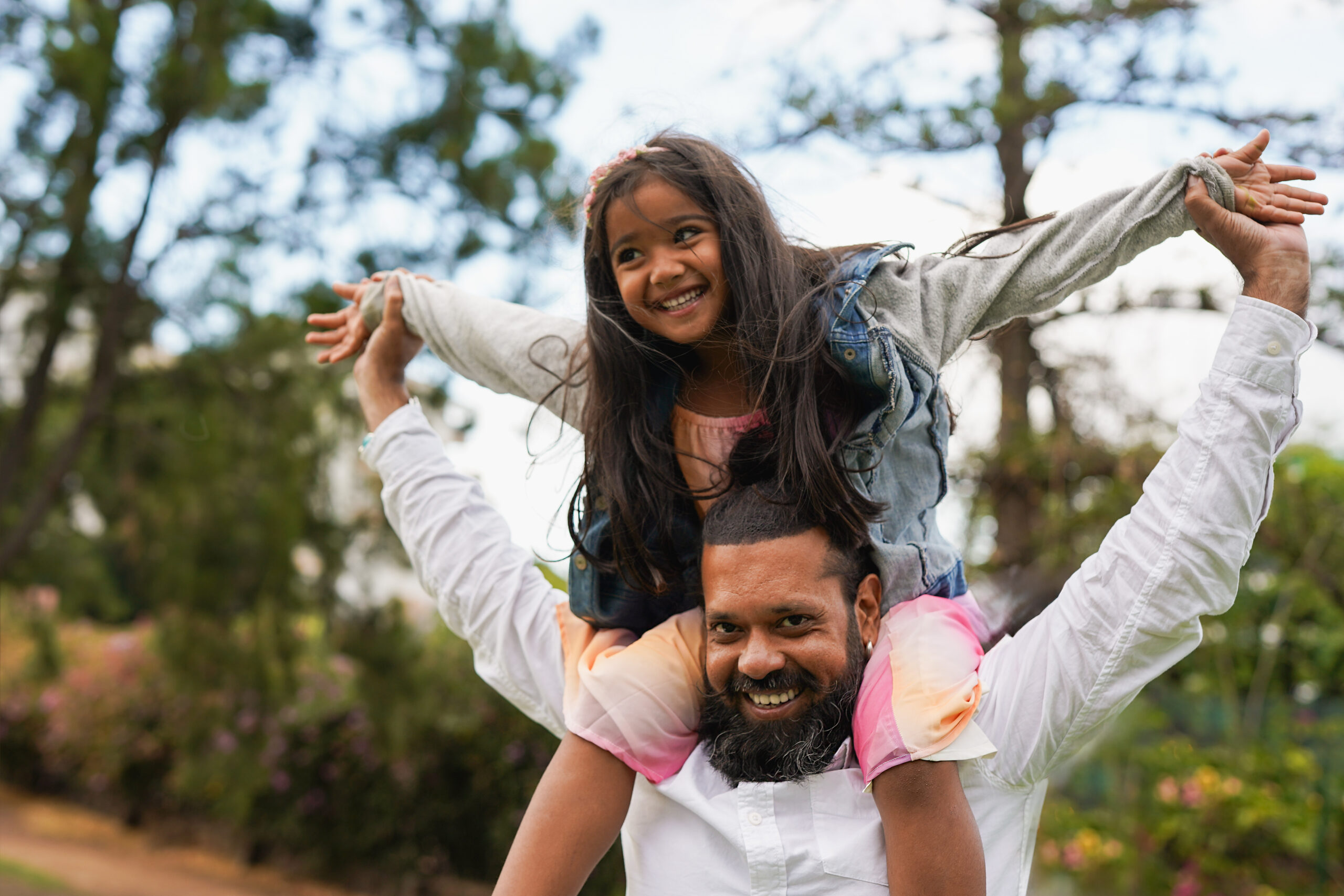 Happy father after support from an attorney to avoid divorce mistakes