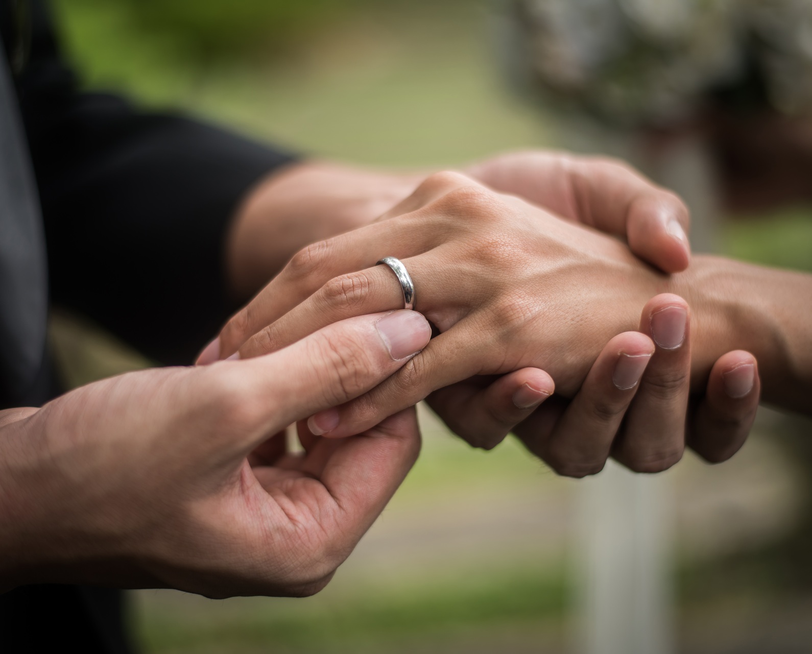 Close up of groom wears the ring bride in wedding day. Love, happy marry concept.