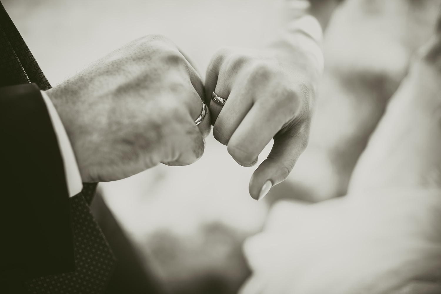 man and woman holding hands. wedding rings bride and groom on the background. Wedding ceremony. Jewelry.