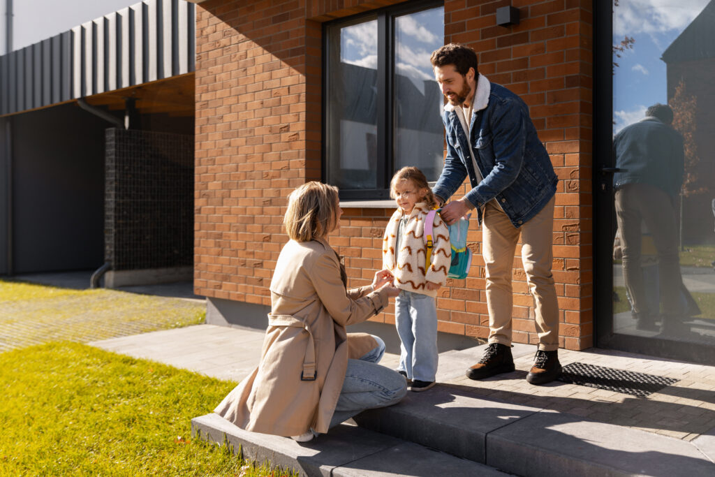 Parents helping a child prepare for school after a Georgia divorce.