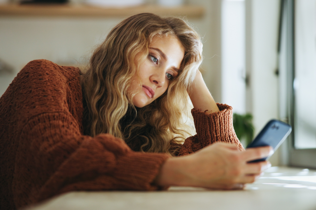 woman-looking-at-phone-georgia-custody-dispute